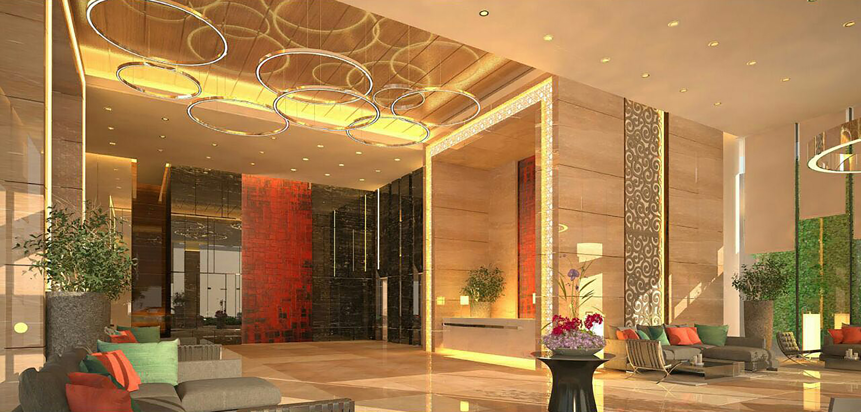a lobby with a large reception desk and a large mirror