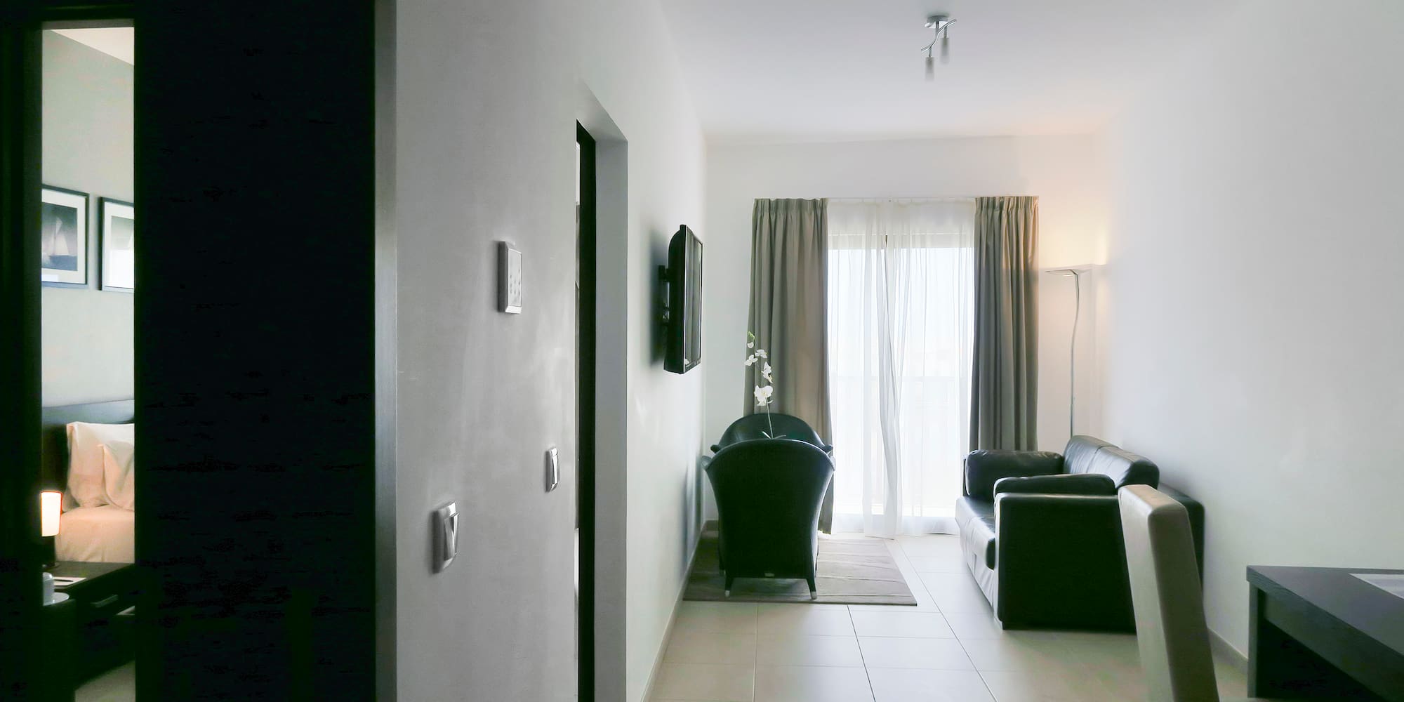 a room with a couch and a door