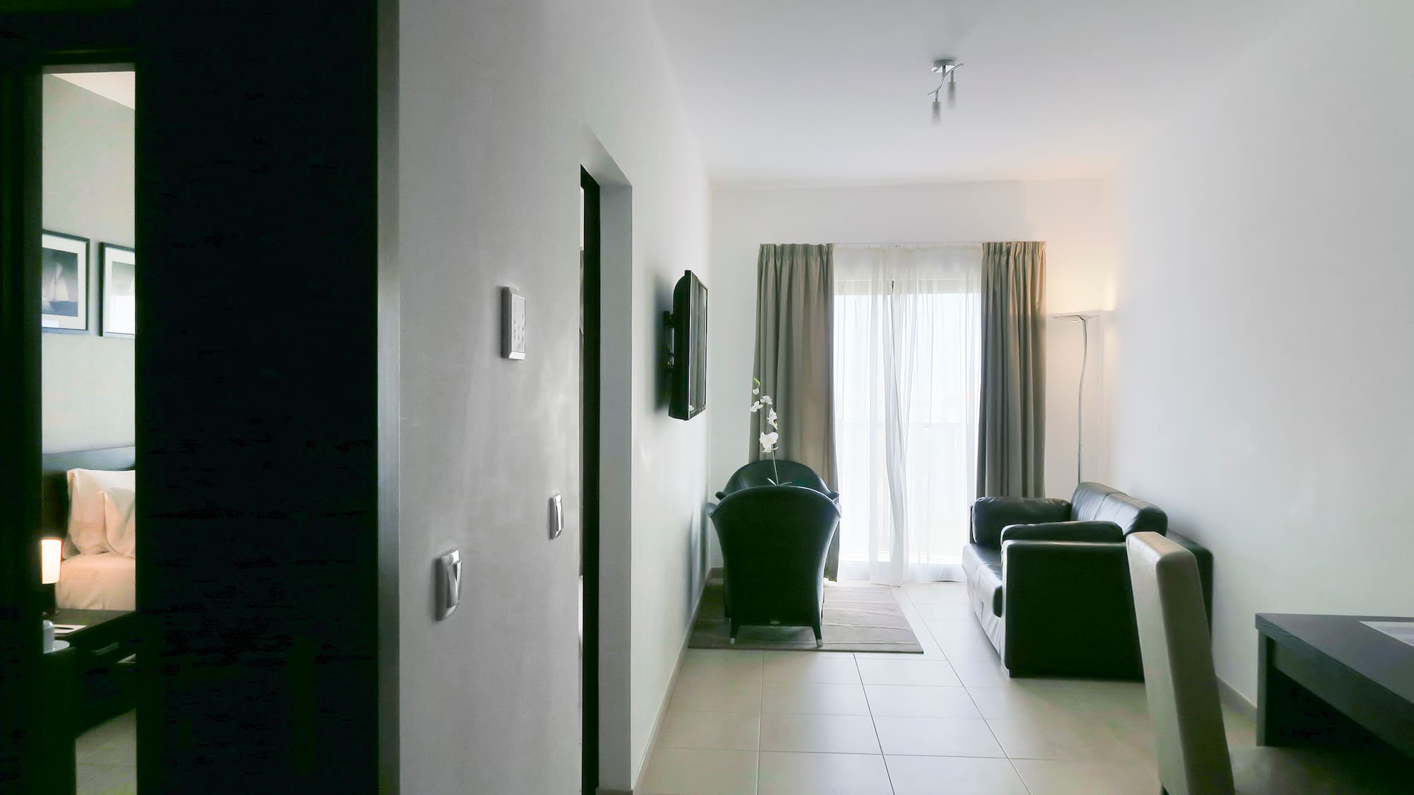 a room with a couch and a door