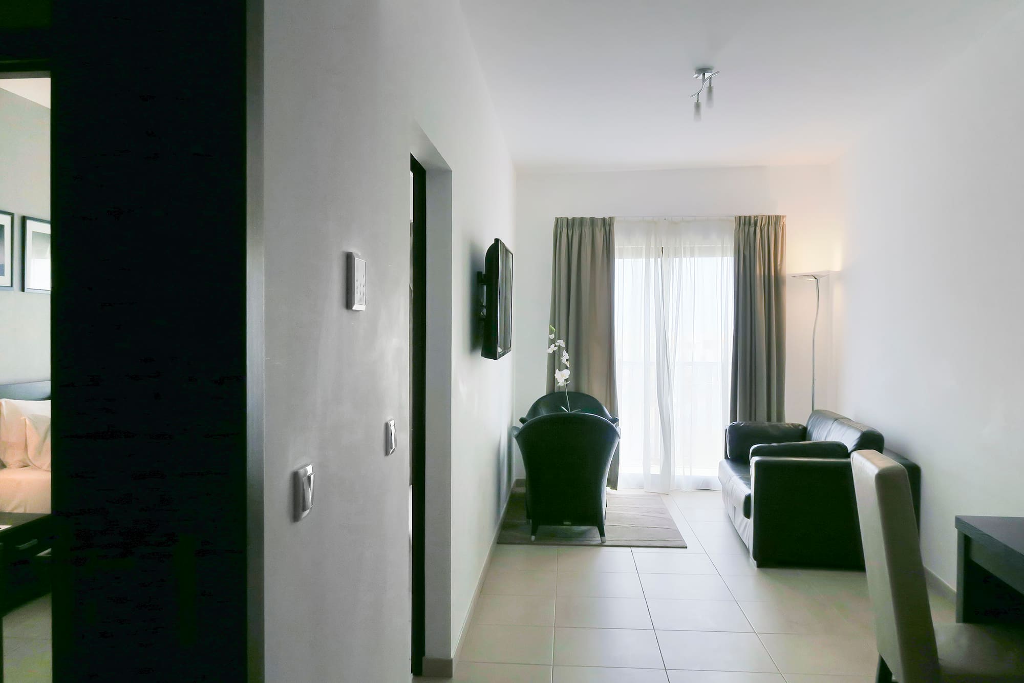 a room with a couch and a door