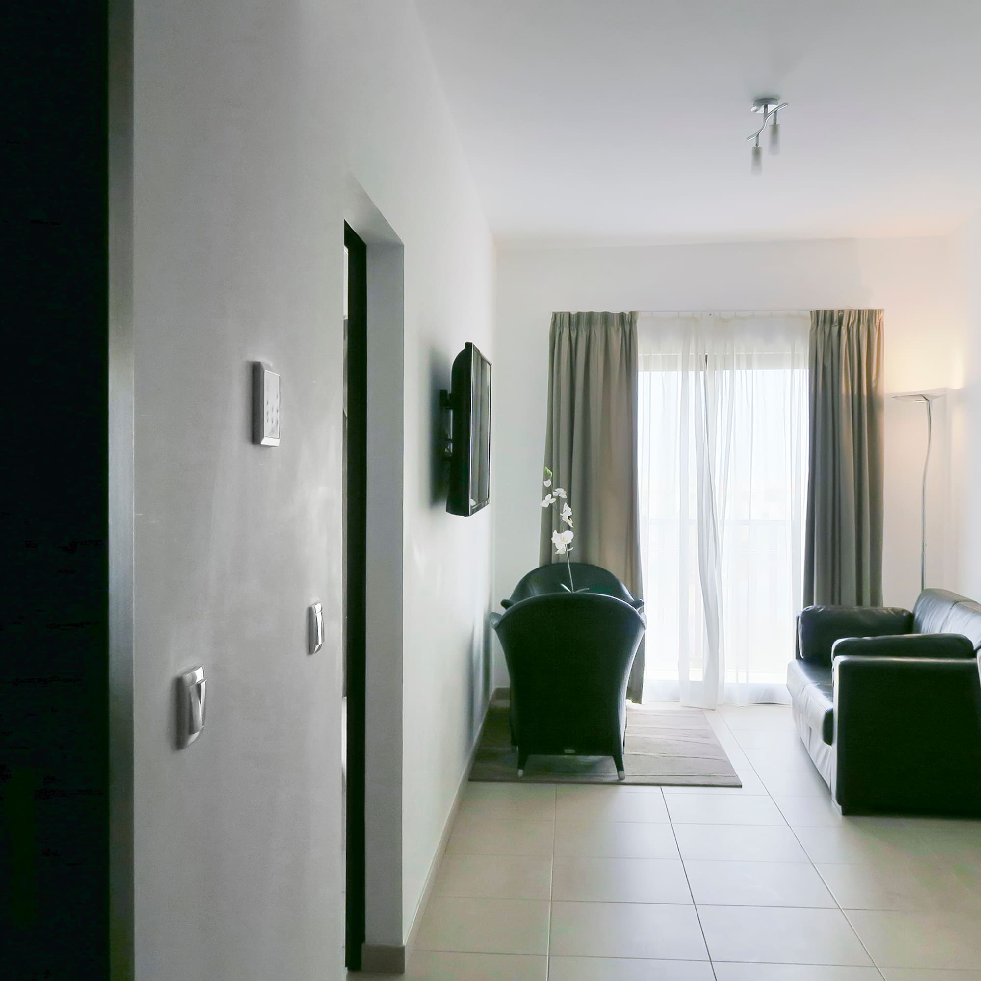 a room with a couch and a door