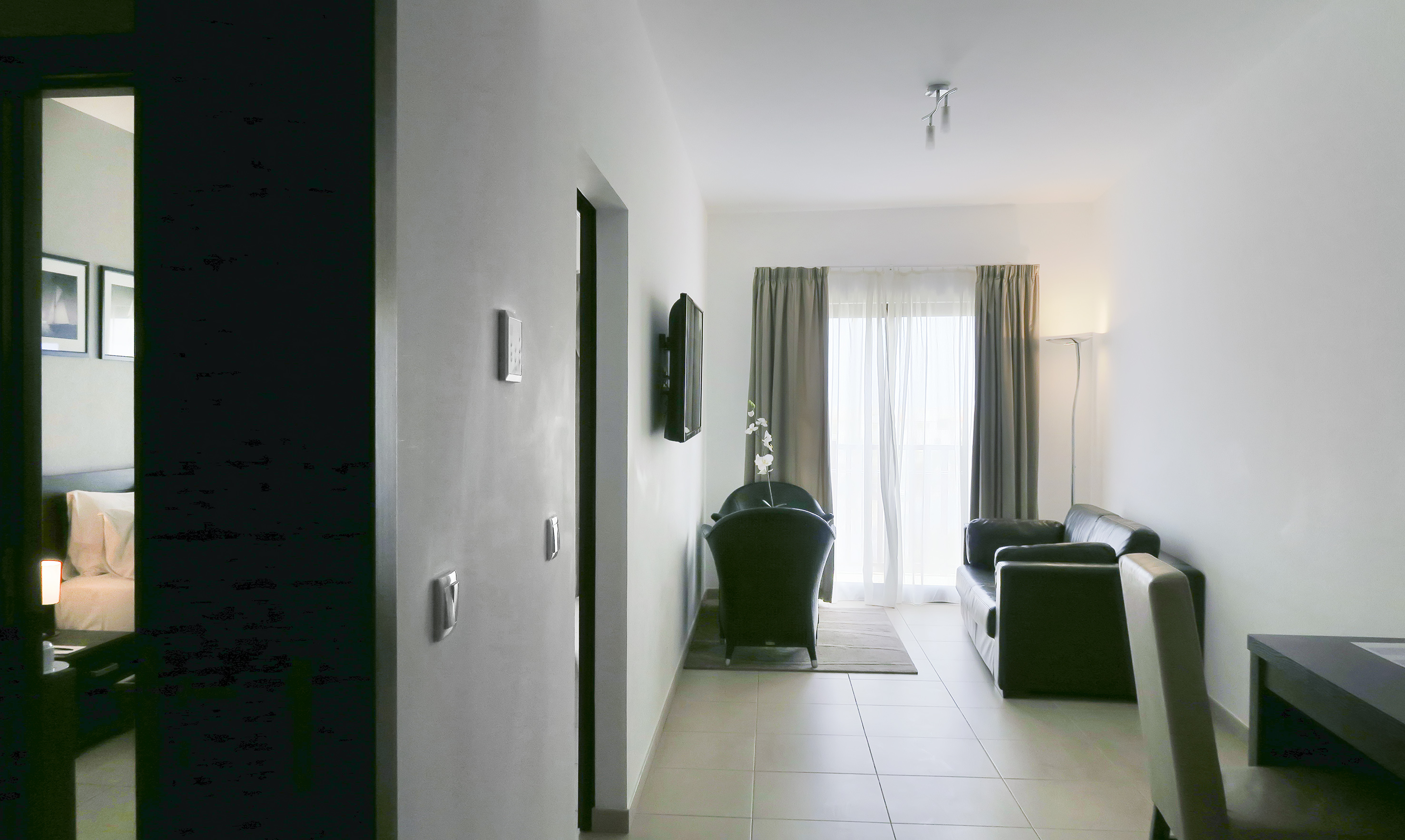 a room with a couch and a door