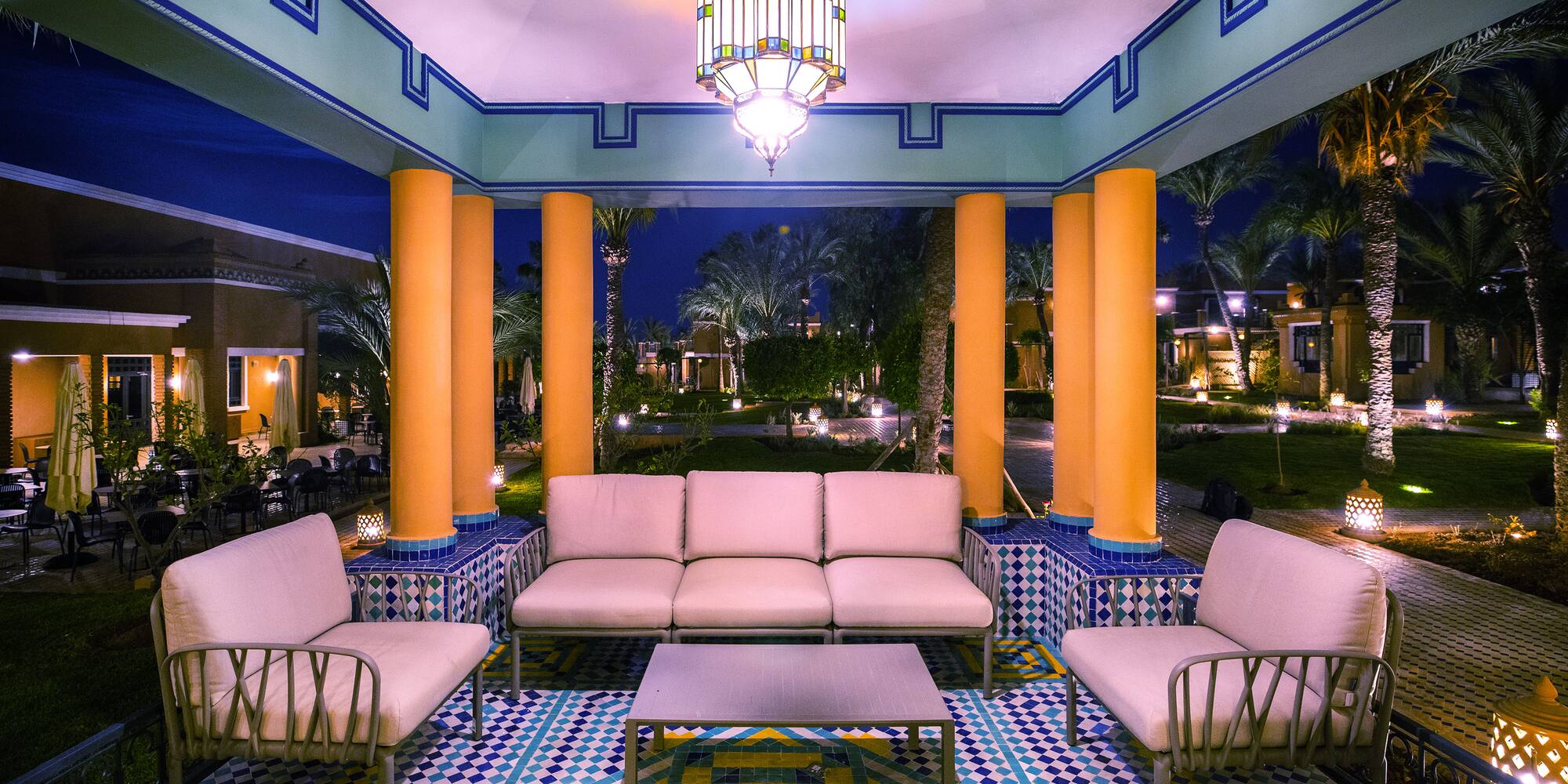 a group of chairs and a chandelier in a room