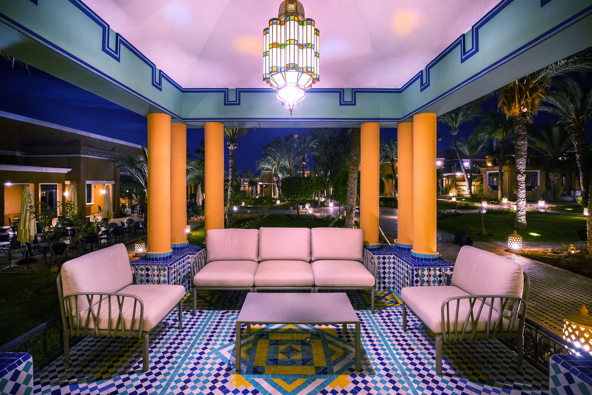 a group of chairs and a chandelier in a room
