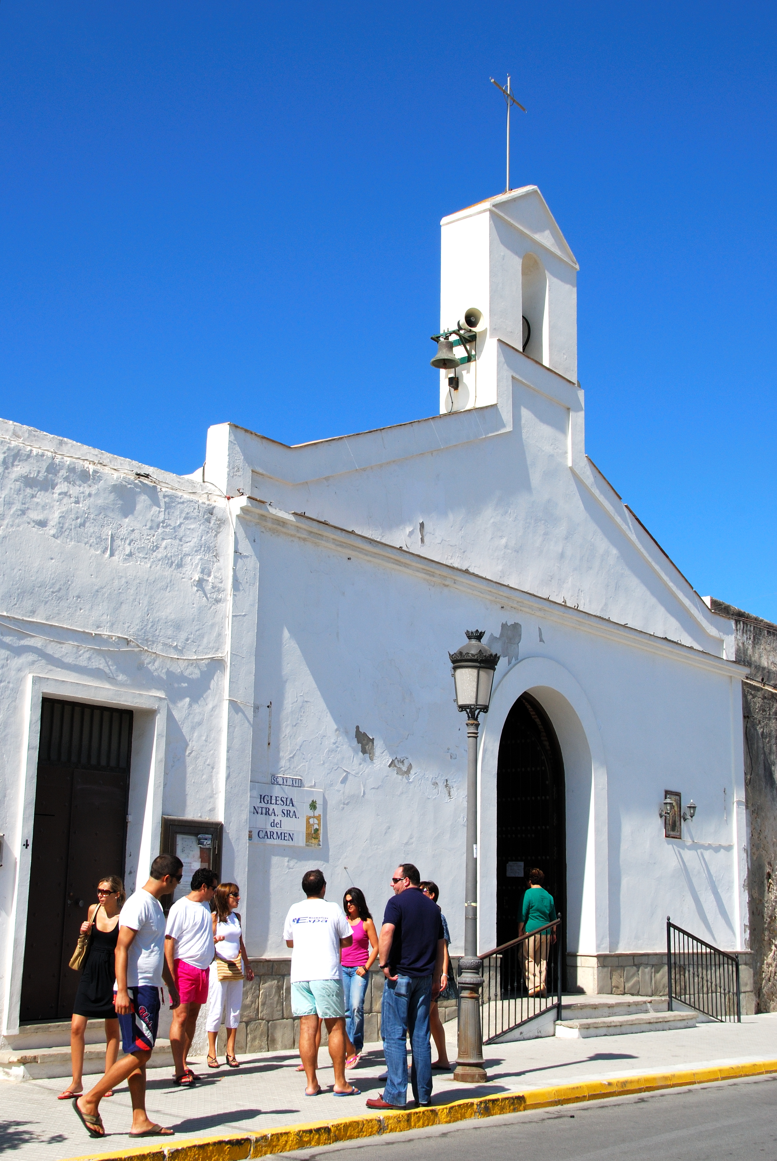 a group of people outside of Church of San Pedro de Atacama