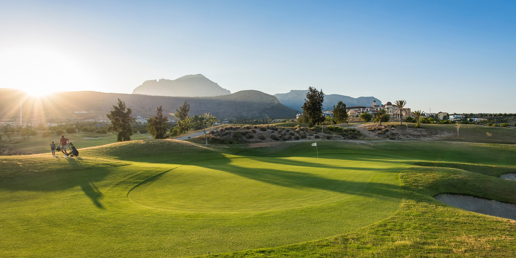 a golf course with a flag on the ground