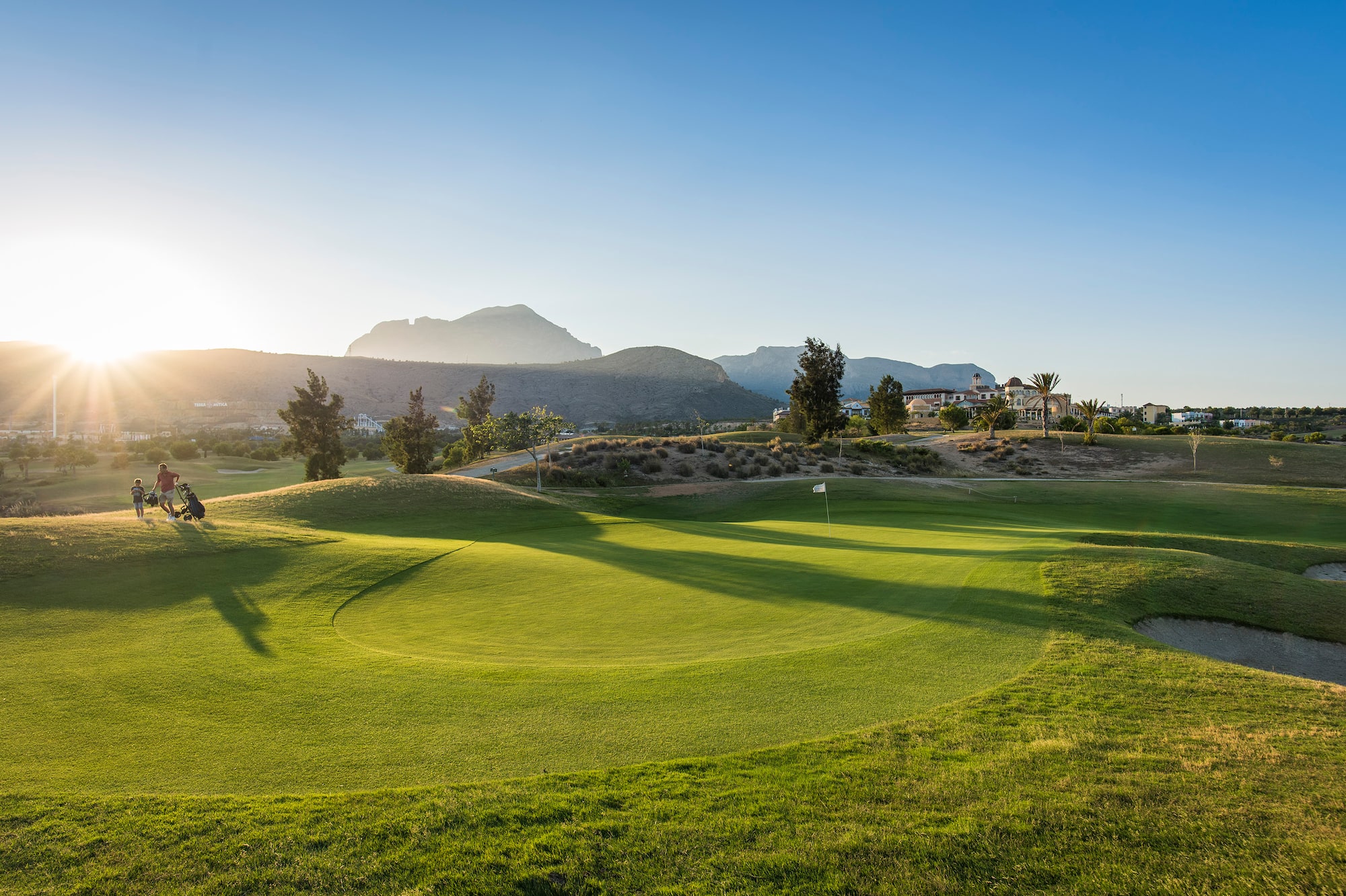 a golf course with a flag on the ground