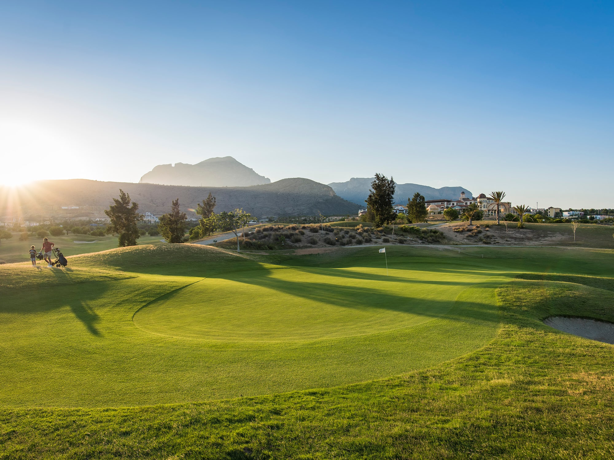 a golf course with a flag on the ground