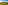 Sunset over green golf course with two golfers, mountains, and distant resort.