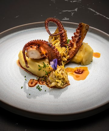 a plate of food on a black surface