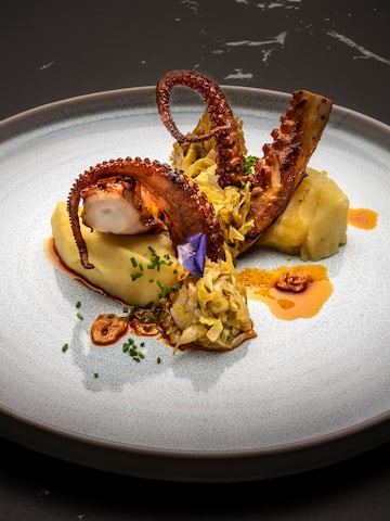 a plate of food on a black surface