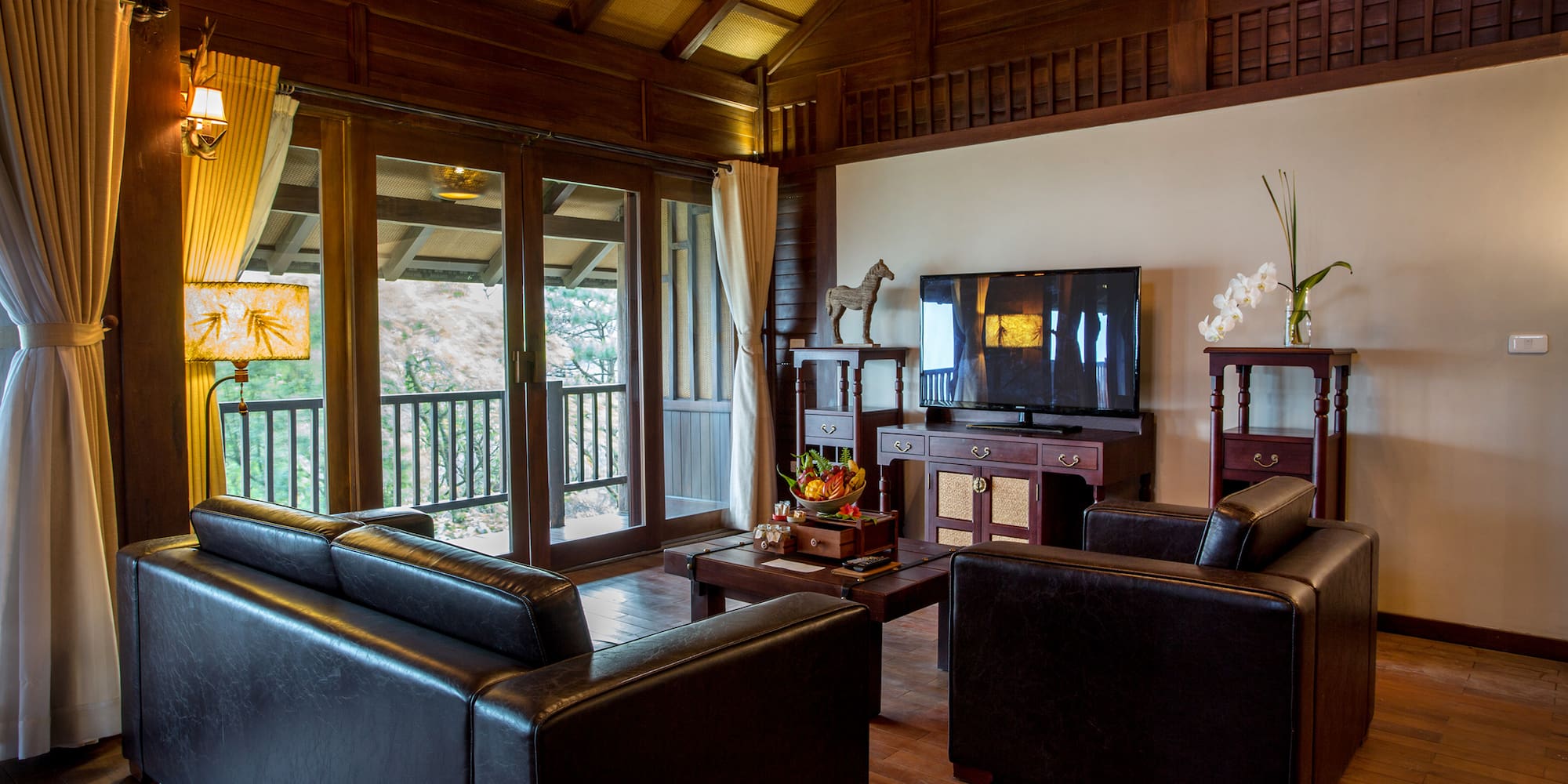 a living room with a television and couches