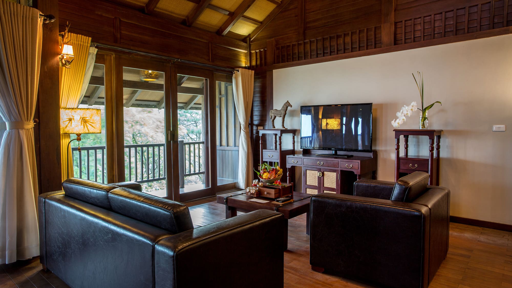 a living room with a television and couches