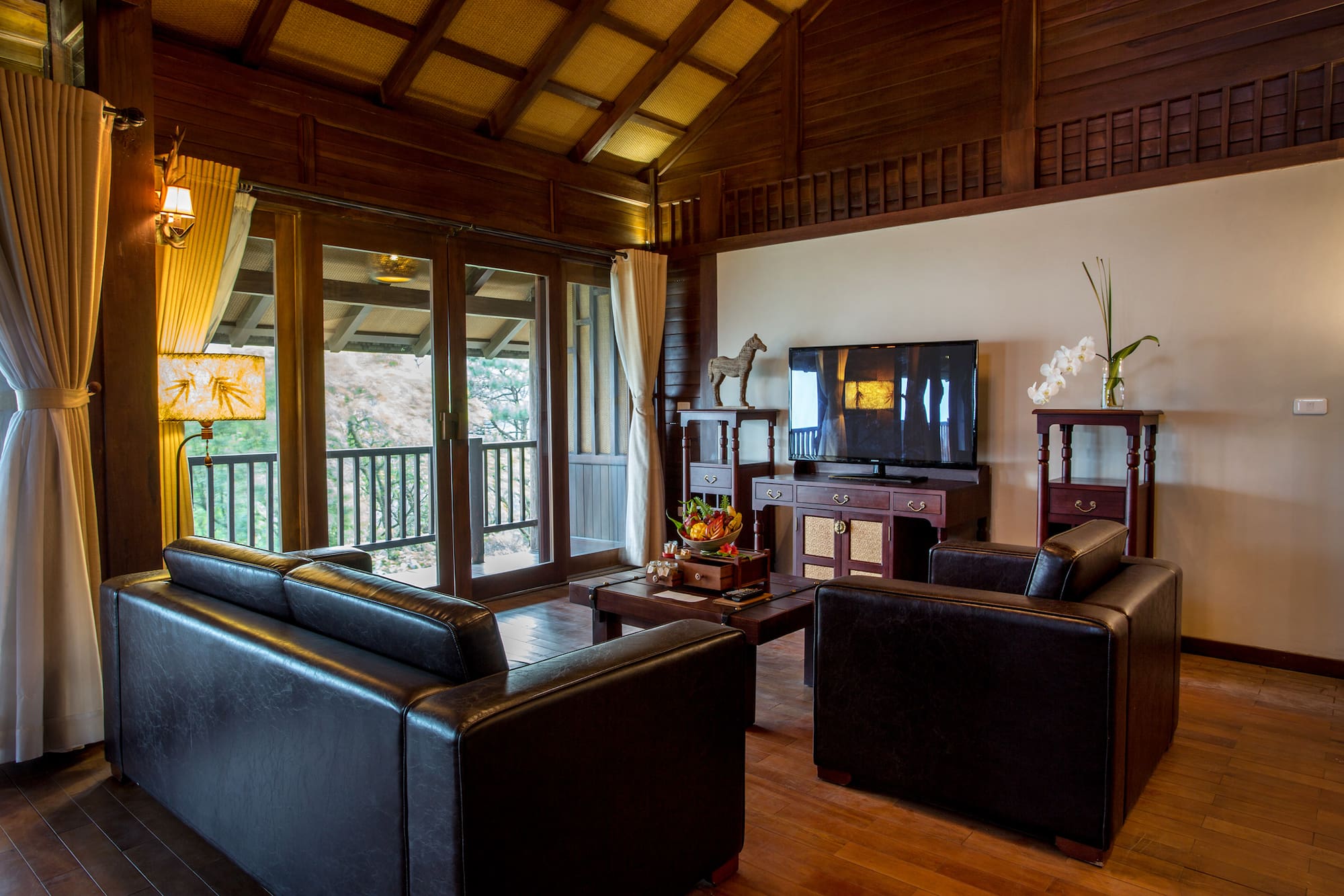 a living room with a television and couches