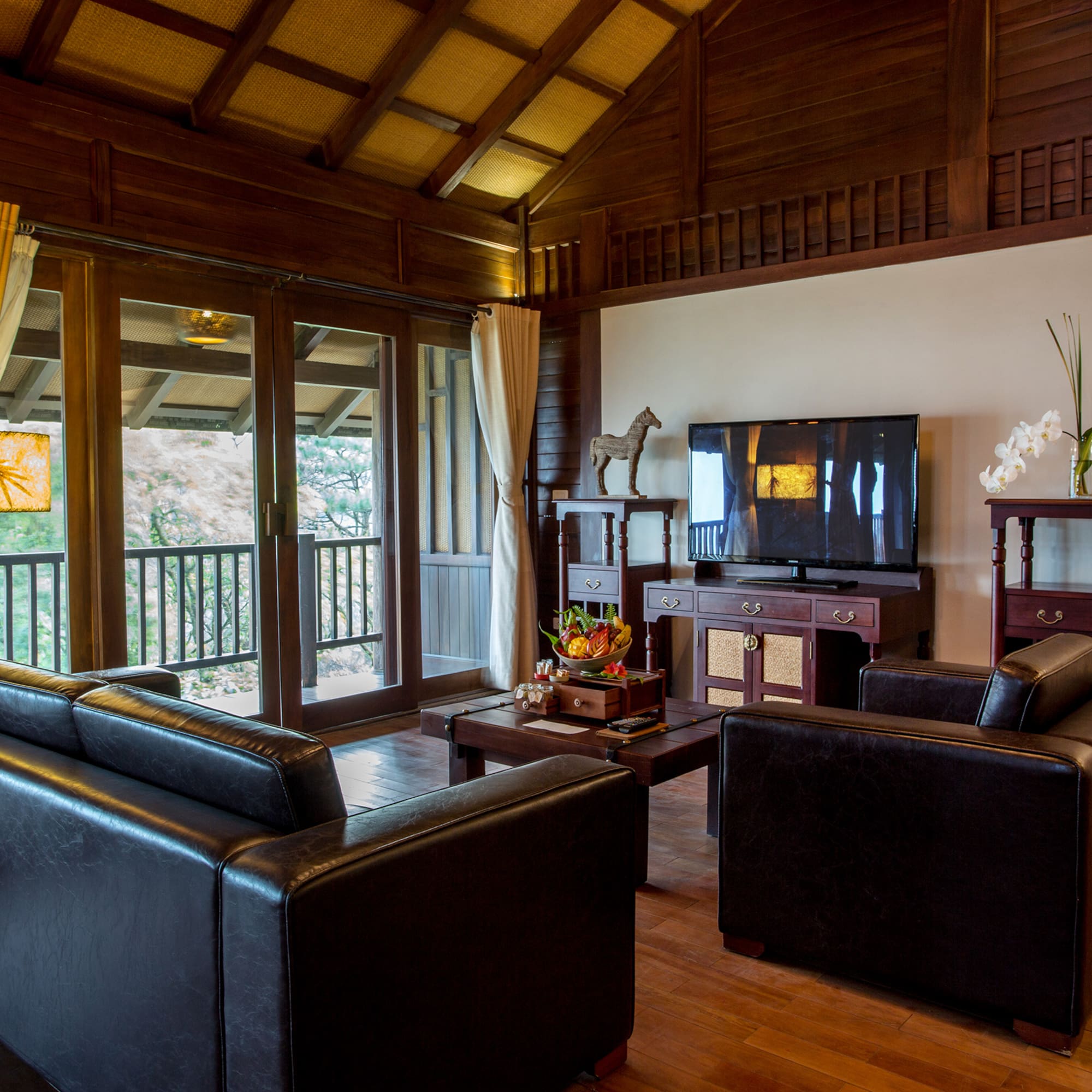 a living room with a television and couches