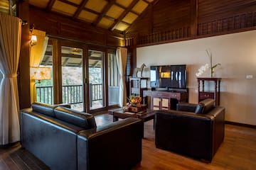 a living room with a television and couches