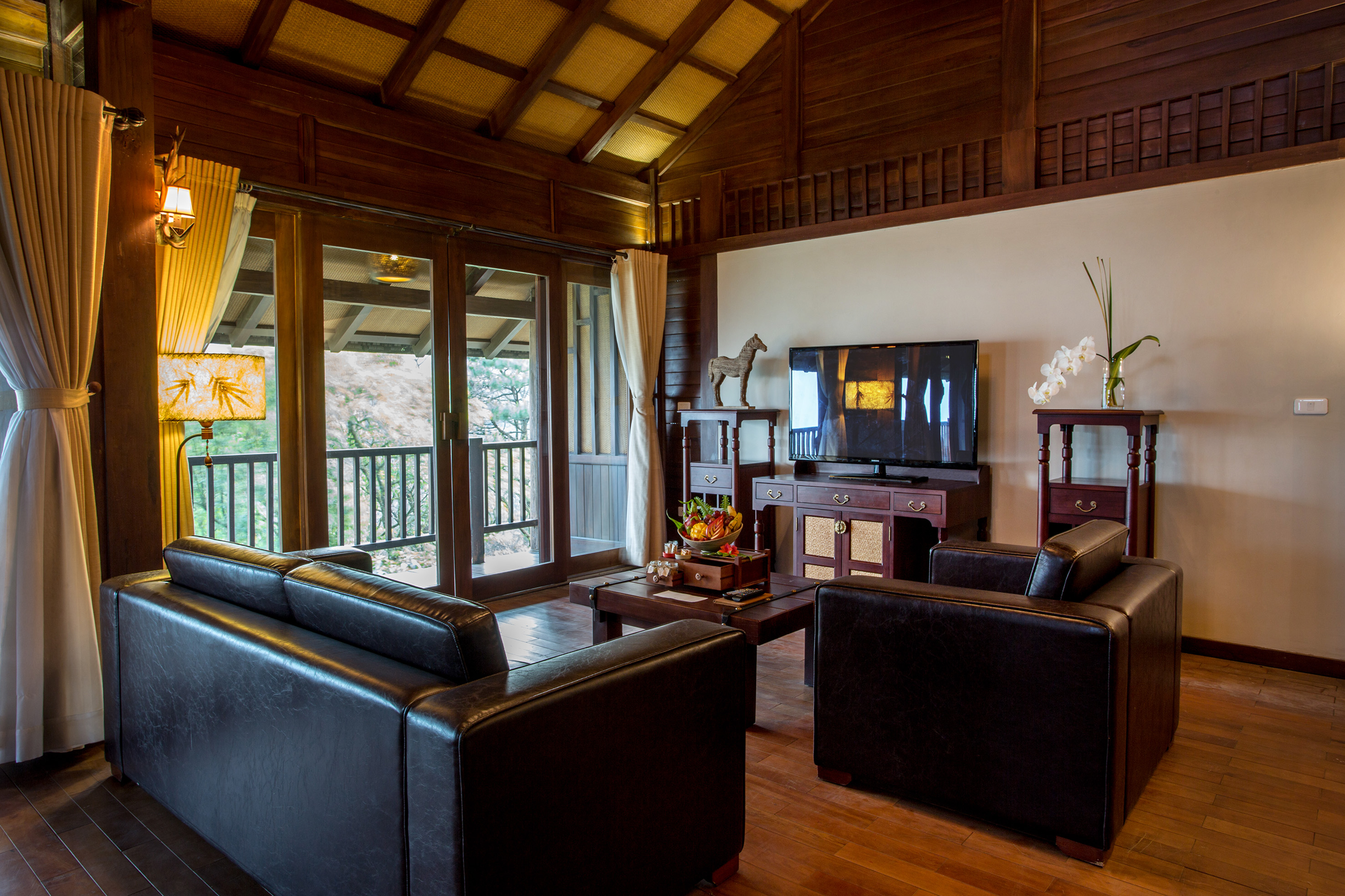a living room with a television and couches