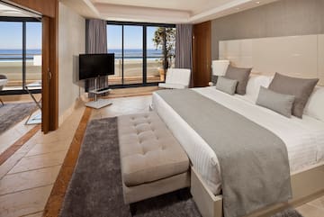 a bedroom with a large bed and a television