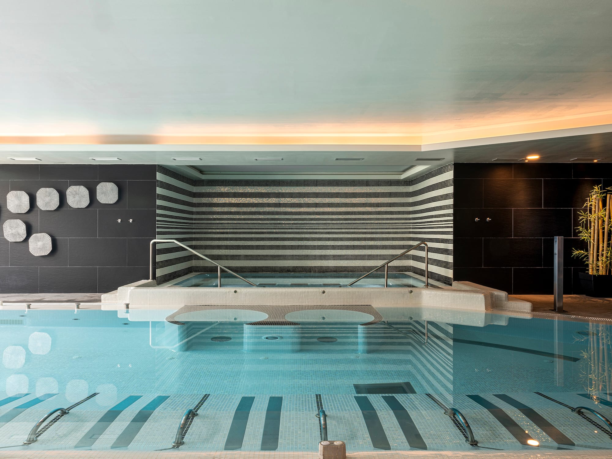 a swimming pool with a railing