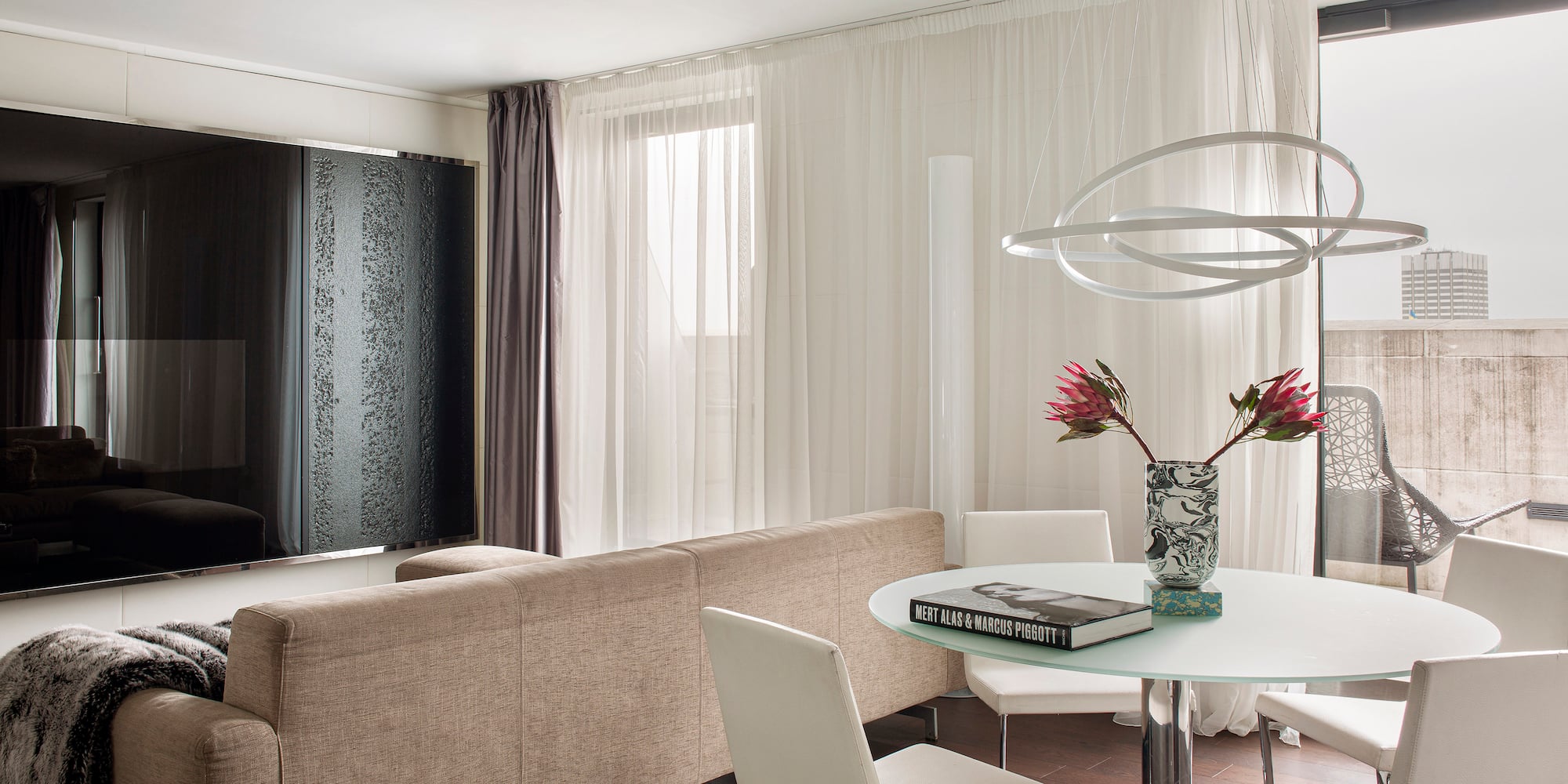 a living room with a couch and a table