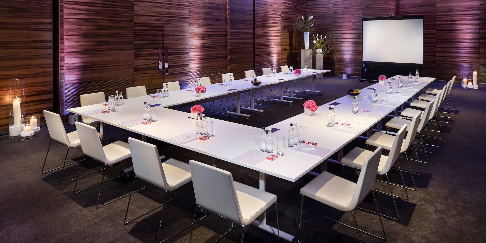 a room with a large table and chairs