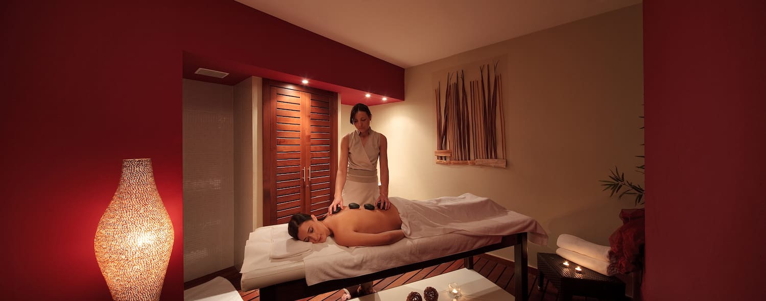 a woman getting a hot stone massage
