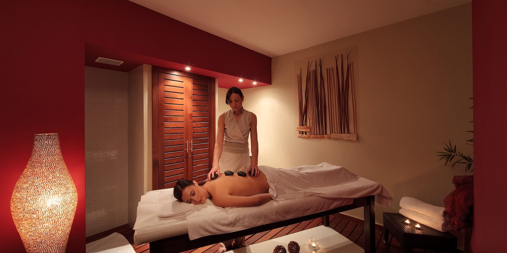 a woman getting a hot stone massage