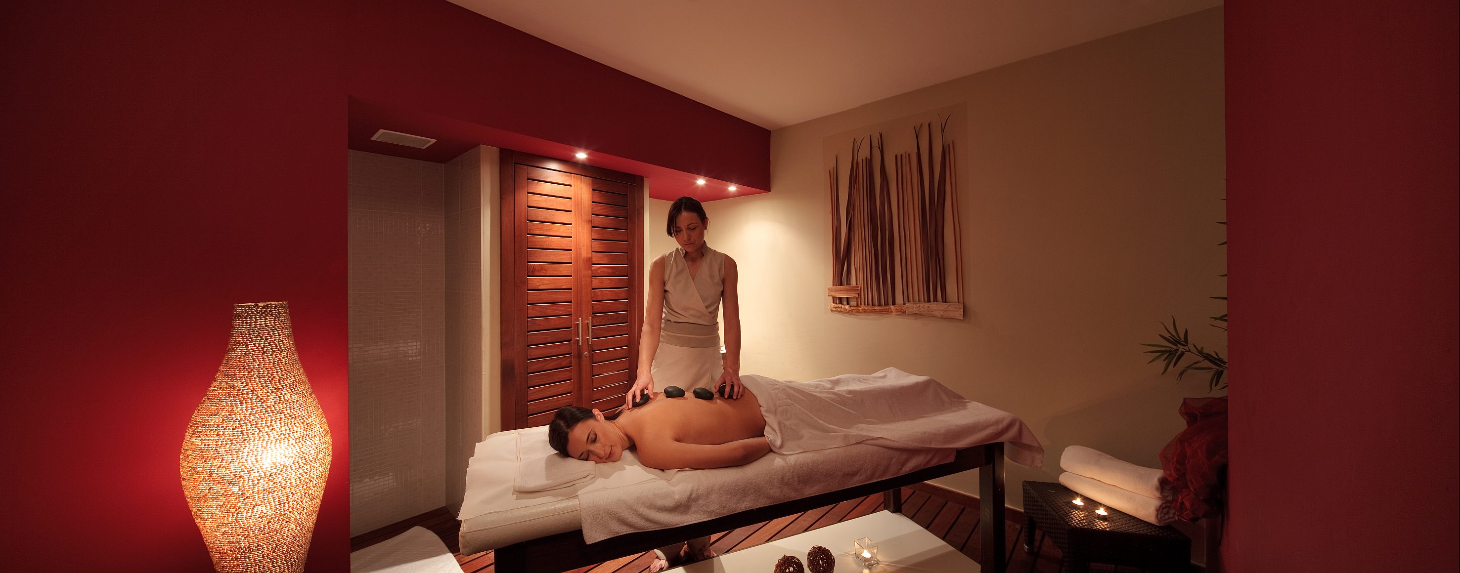 a woman getting a hot stone massage