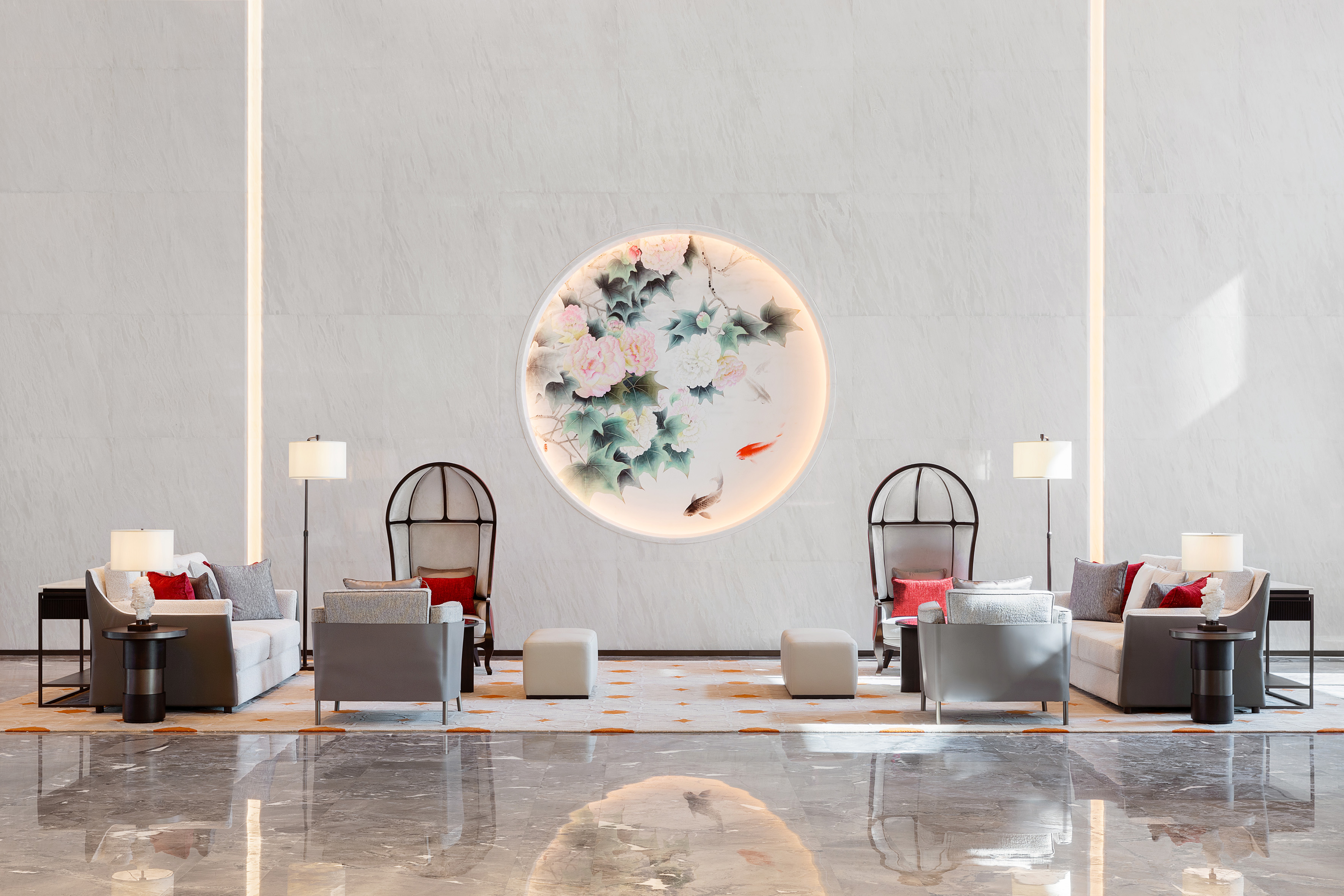 Modern luxury lobby with illuminated oriental peony & koi fish art and seating.