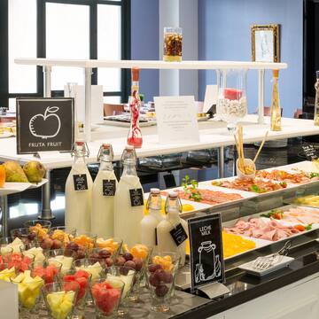 a buffet table with food and drinks