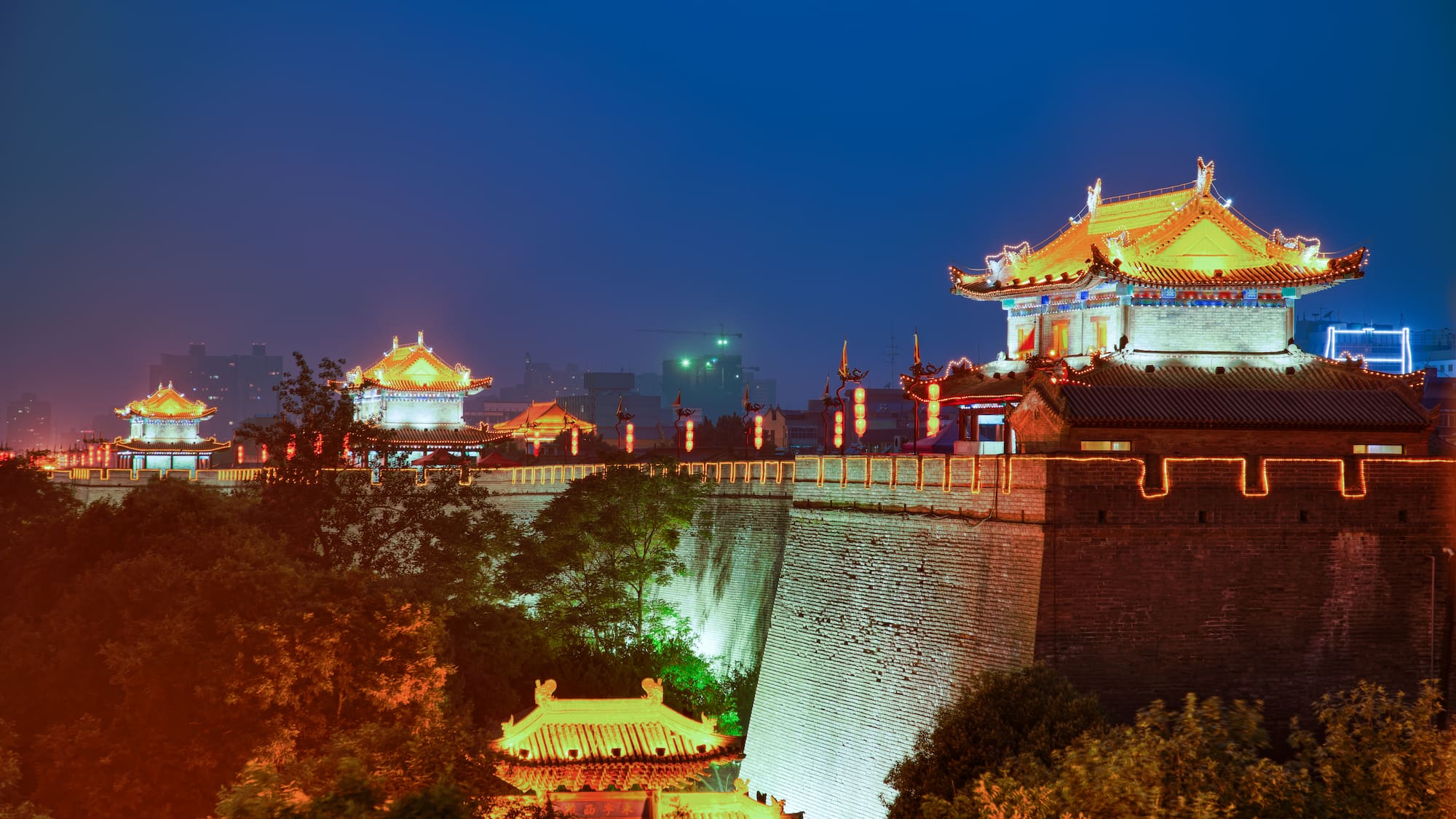 a building with lights on top of a wall