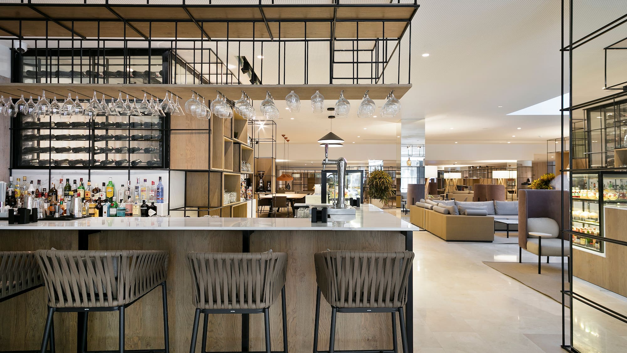 a bar with chairs and a bar stools