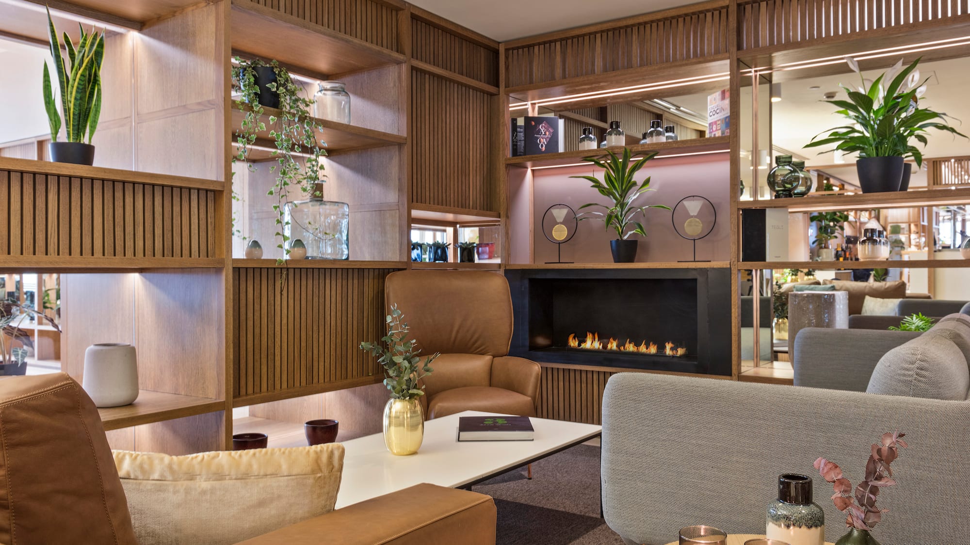 a room with a fireplace and chairs