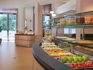 a buffet with different foods on it