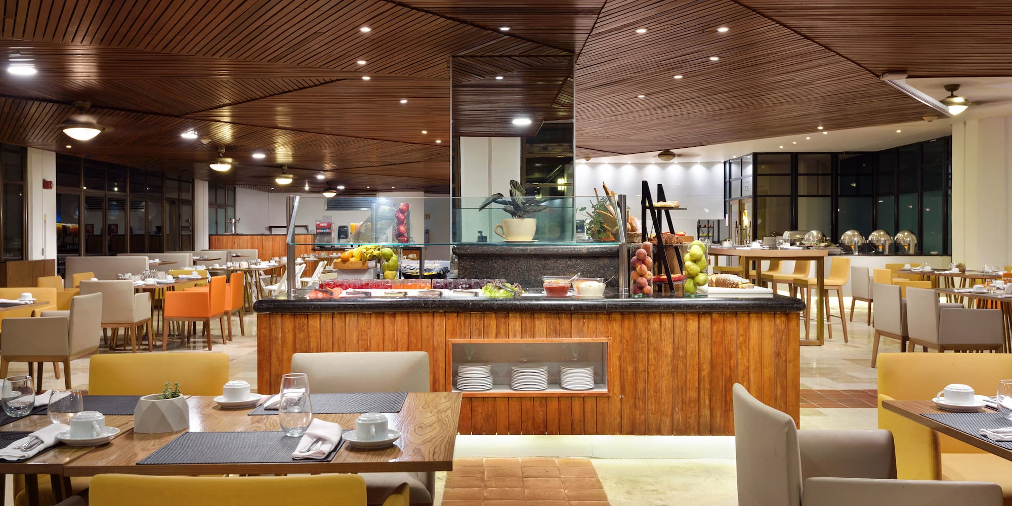 a restaurant with a buffet table and chairs