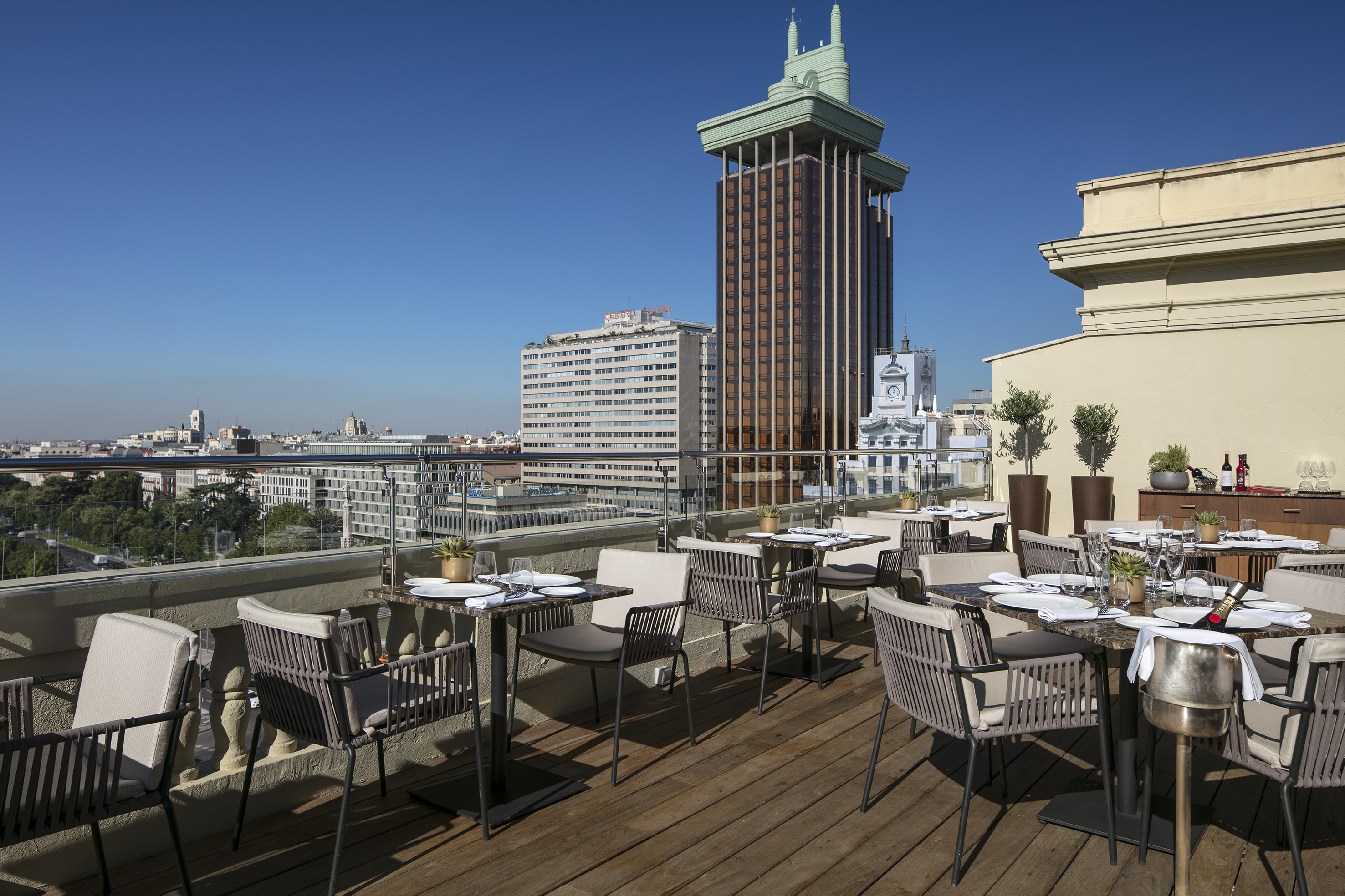a table and chairs on a rooftop