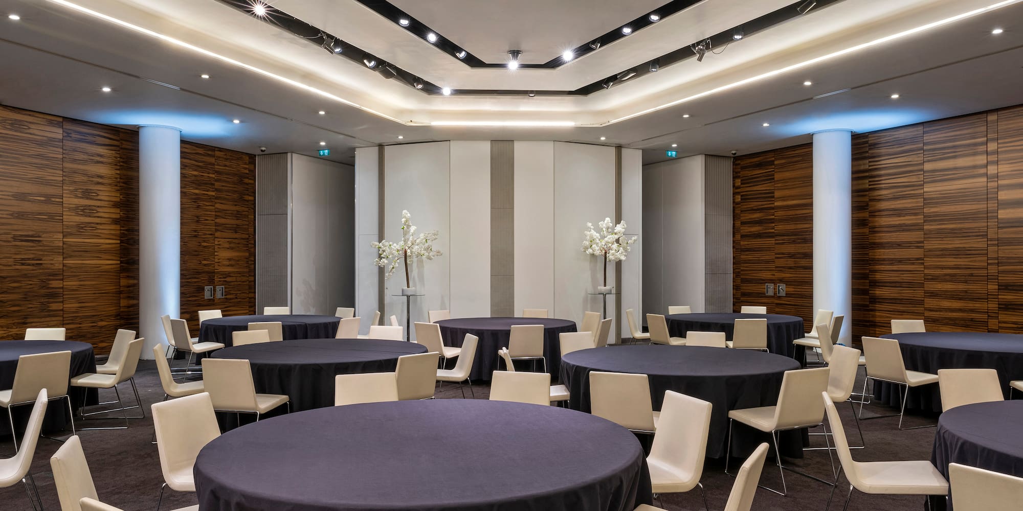 a room with round tables and chairs