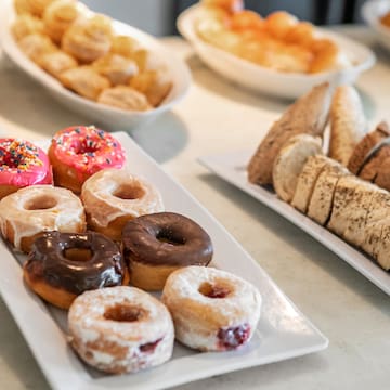 a plate of donuts and pastries