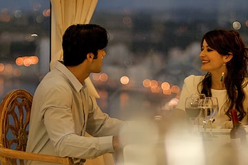 a man and woman sitting at a table