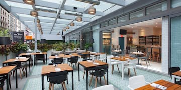 a restaurant with tables and chairs