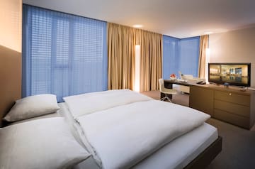 a room with a bed and a desk