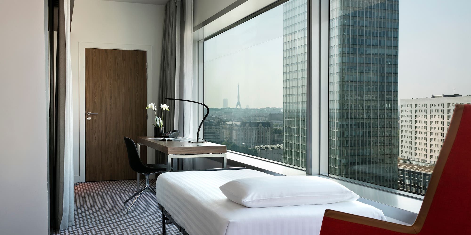 a room with a window and a table and chairs