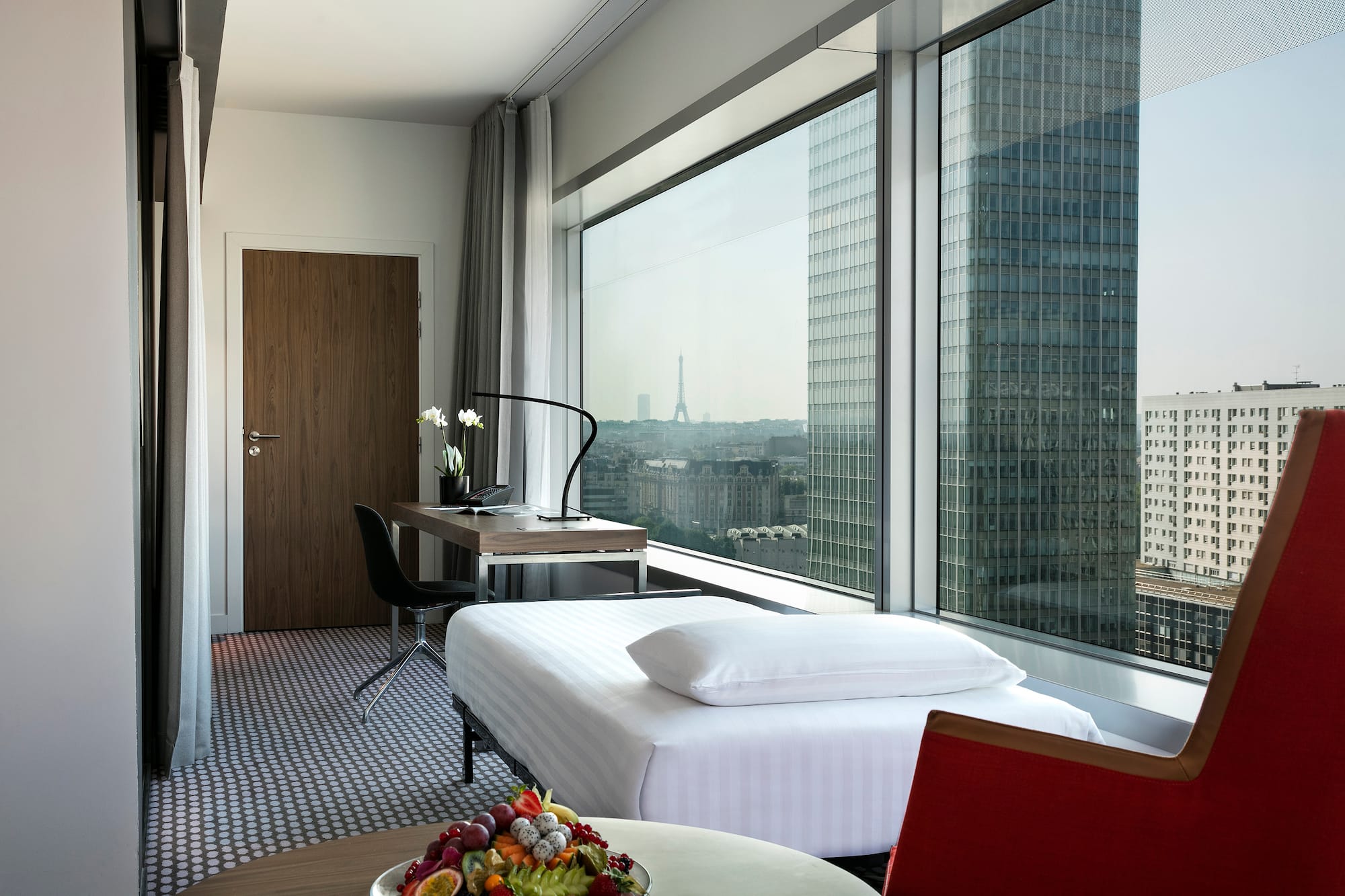 a room with a window and a table and chairs