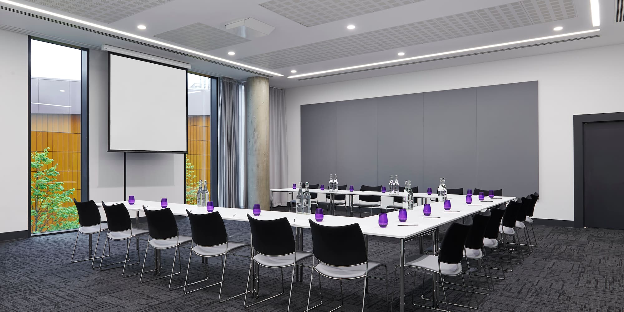 a room with a large table and chairs