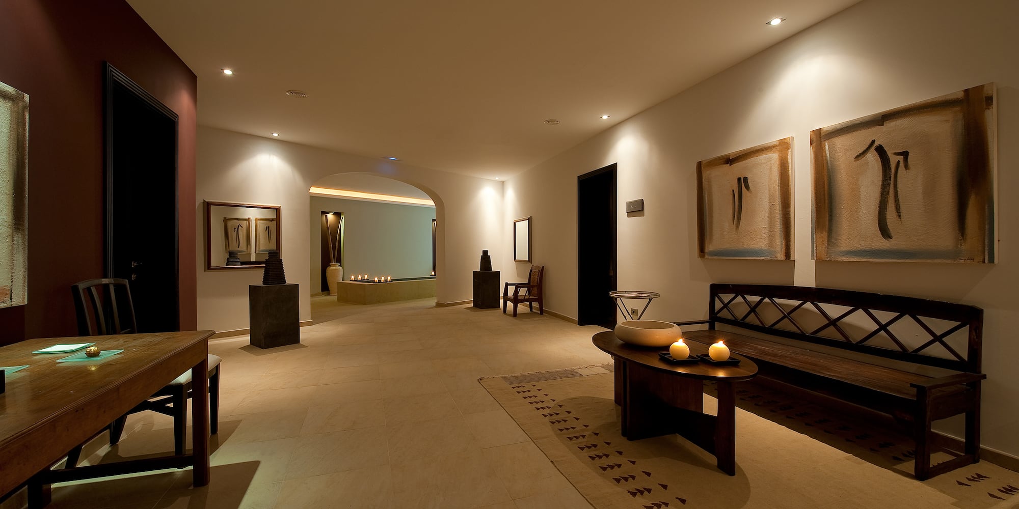 a room with a bench and a table