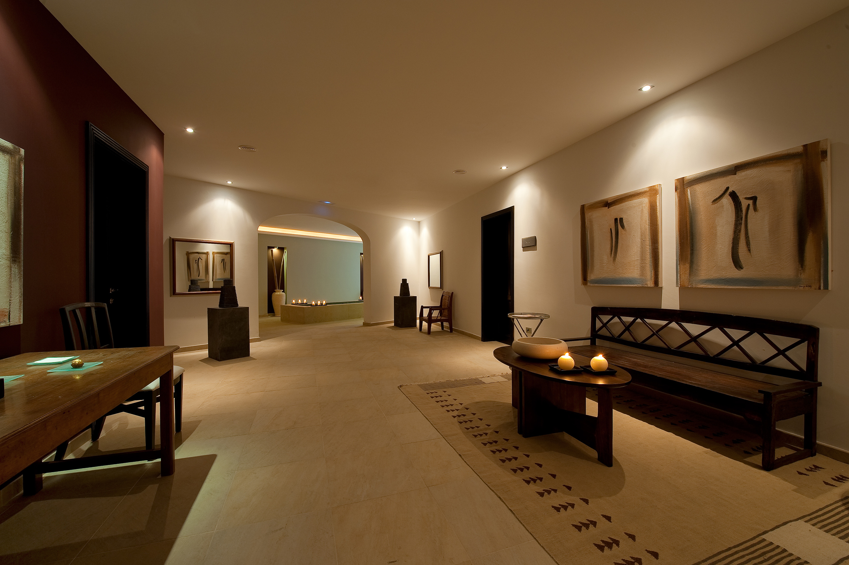 a room with a bench and a table