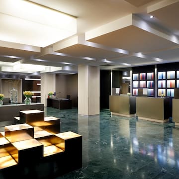 a lobby with a reception desk and counter