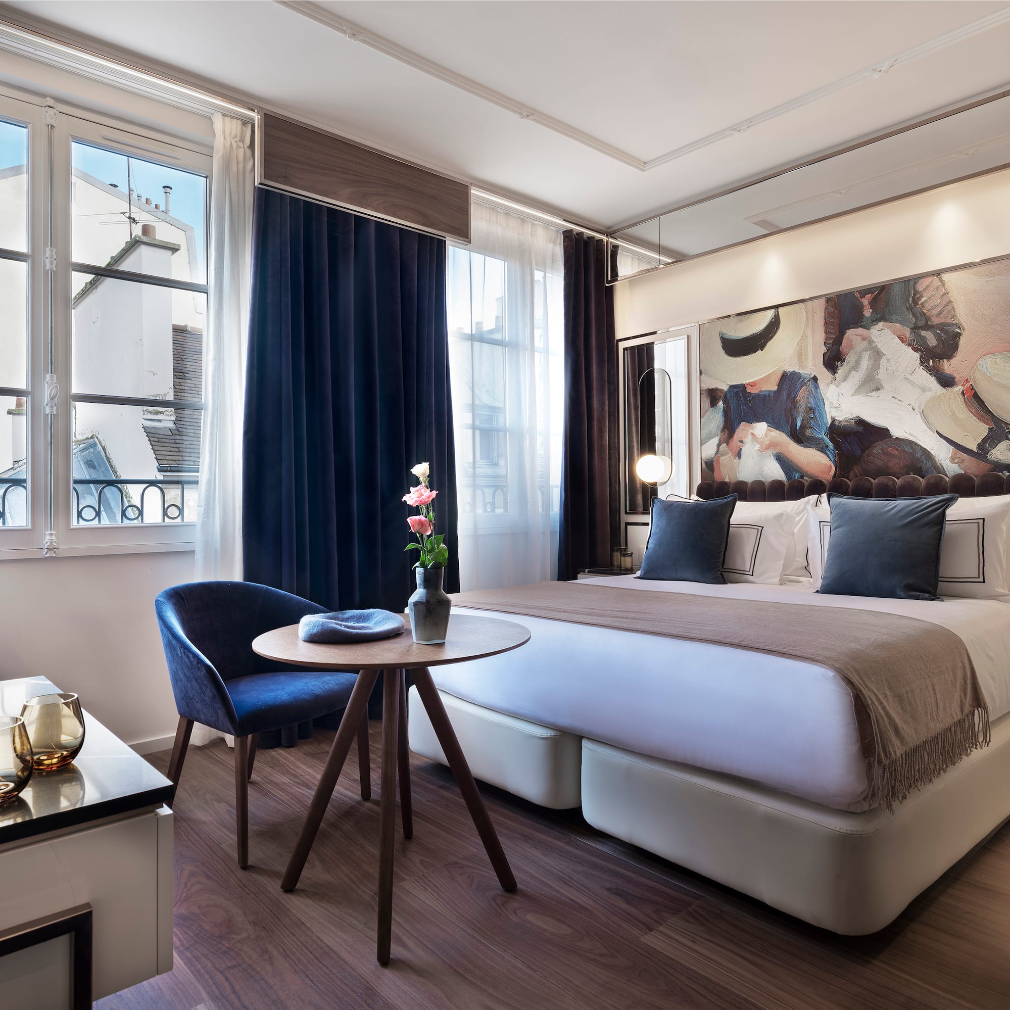 a bedroom with a bed and a table