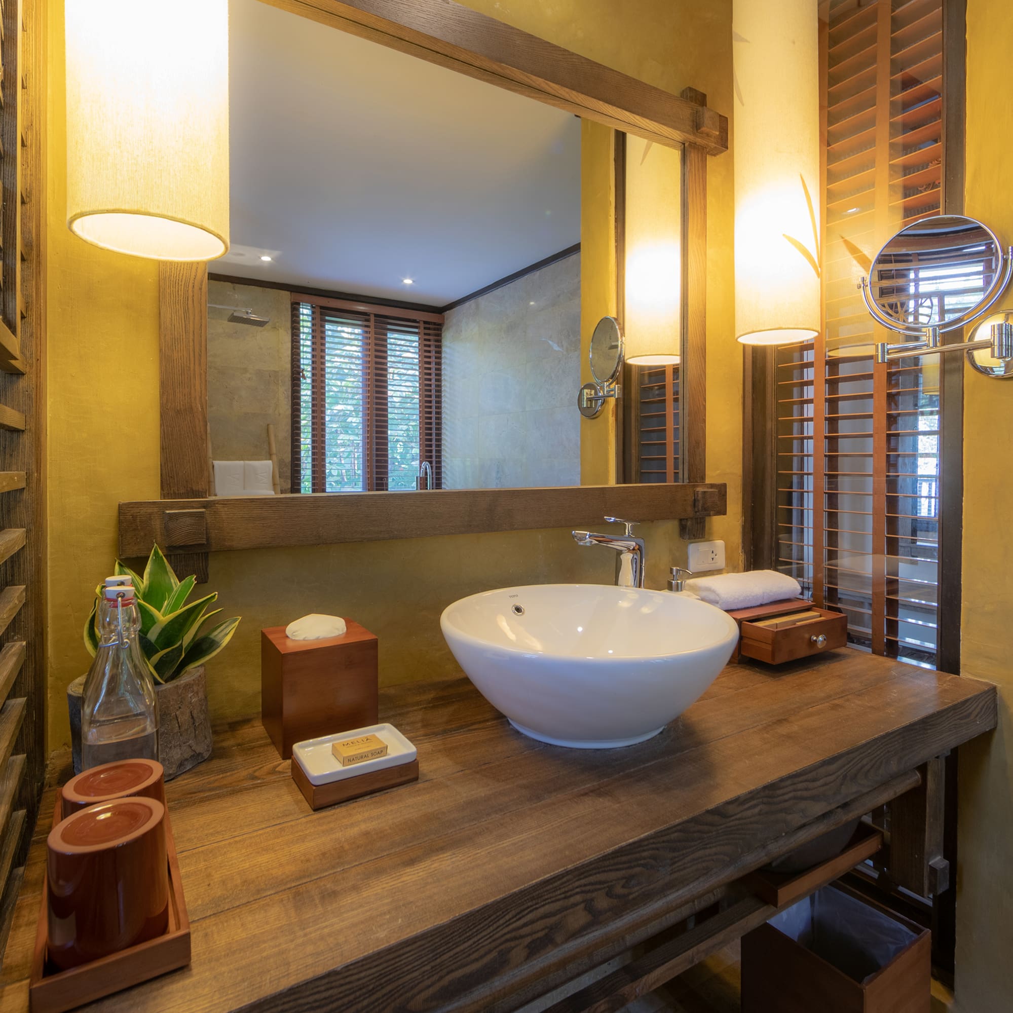 a bathroom with a sink and mirror