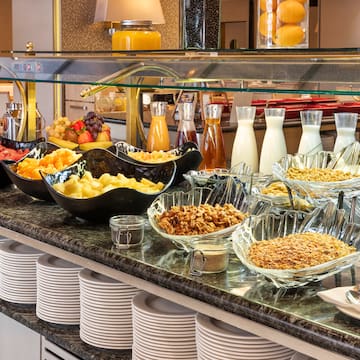 a buffet with plates of food and drinks